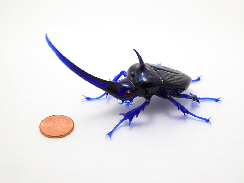 Cobalt Bling Rhino, glass rhinoceros beetle by Wesley Fleming